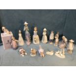 A collection of Spanish porcelain figurines - mainly Lladró and Nao - girls, ducks, dogs, a sleeping