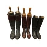 A pair of Bartlett & Son leather hunting boots with brown calf borders, having hardwood trees with