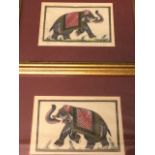 Indian watercolours on woven fabric, a pair, elephants on floral ground, mounted & gilt framed. (6.
