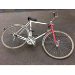 A Raleigh Equipe bicycle with padded seat, aluminium mudguards, tyre pump, lever gears, etc.