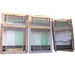 A set of three unusual rectangular window frames with moulded glazing bars having several coloured