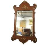 A George II style mirror with shaped plate in acanthus scroll carved frame painted with flowers on