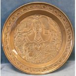 An Elizabethan style brass bowl embossed with stylised mermaid queen, having border with chevron