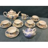 A Villeroy & Boch six-piece teaset decorated with fruit bands; and a Bristol China blue floral