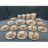 An Italian handpainted kitchen set with storage jars, a pair of serving platters and 12 plates,