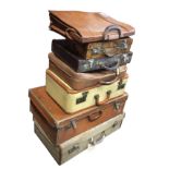 Six miscellaneous suitcases - some leather; and a leather briefcase. (7)