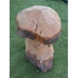 A chainsaw carved toadstool shaped staddle stool, formed from one log. (21.5in)