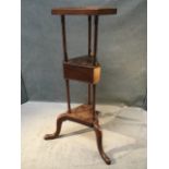 A mahogany shaving stand with later hexagonal tray top on three turned columns above a triangular