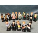 A set of 15 Royal Doulton figurines, all modelled as famous Dickensian characters, mounted on square