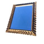 A large rectangular mirror in Ieaf carved moulded frame. (43.25in x 35.5in ext)