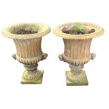 A pair of Victorian stoneware urns of fluted campana form having lozenge moulded rims, the pots with