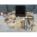 A locking Chubb strongbox containing a quantity of jewellery, badges, collectors items, militaria, a
