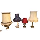A brass fluted column tablelamp with fabric shade; an alabaster lamp with gilt metal mounts having