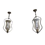 A pair of oil lamp style hall lanterns with acid etched decoration to vase shaped glass shades in