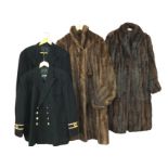 A pair of naval uniform jackets with double breasted brass buttons; and two ladies long fur coats