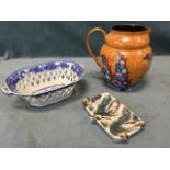 A Carlton Ware jug decorated with polychrome flowers on russet ground, with burnished gilt