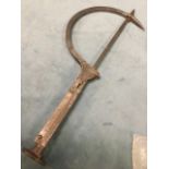 A steel Darby thatching needle, with crescent shaped hooked gatherer mounted on handle with