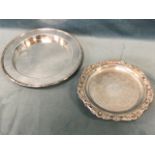 A nineteenth century style circular silver plated salver with foliate scrolled decoration, having