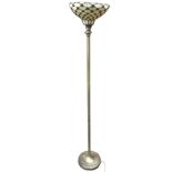 An art deco style standard lamp with leaded glass shade on ribbed faux brass column, above a