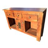 A hardwood dresser base with rectangular top above three frieze drawers mounted with brass knobs,