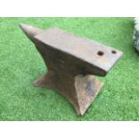 A cast iron anvil, the rectangular working block with tapering point on waisted stand. (21.5in)