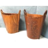 A pair of 60s Danish rosewood wastepaper baskets of elliptical tapering shape having side