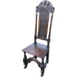 A Victorian carved oak hall chair, the back with arched pierced scrolled crest above a panel with