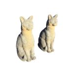 A pair of composition stone cats seated on their haunches. (21.25in) (2)