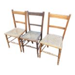 A married set of three cane seated chairs with moulded back rails above tapering cane seats,