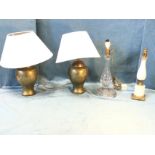 A pair of hammered brass tablelamps of ginger jar form mounted with conical shades; a heavy cut