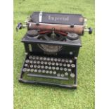 A C20th Imperial manual typewriter, the Leicester made machine with ribbon, cork roller and tiered