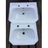 A large Heritage washbasin with integral soap dishes and canted corners; and a matching smaller