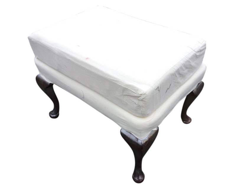 A rectangular upholstered stool with cushion to seat having loose cover, raised on cabriole legs.