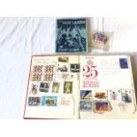A stamp album containing GB stamps; and a 'schoolboy' Blue Lagoon stamp album with miscellaneous