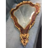 A nineteenth century shield shaped mirror, the bevelled plate in boulle inlaid tortoiseshell