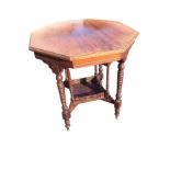 An octagonal walnut window table, the moulded top supported on twisted turned tapering column legs