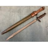 An American WWI bayonet, the M1917 weapon with grooved handle, the 17in blade marked Remington 1917,