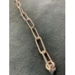 An Italian made silver bracelet, the seventeen rope - twist chain links with lobster clasp. (7.5in)