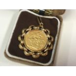 A 1907 sovereign, the coin mounted as a pendant with circular waved scrolled border, having
