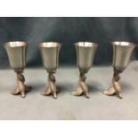 A set of four stirrup cups, the metal bases modelled as cock pheasants in flight. (5.25in) (4)