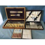 A Victorian walnut cased 12-piece dessert set with hallmarked silver collars and bone handles; a