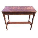 A Victorian walnut centre table with rectangular moulded top on ring-turned tapering legs joined