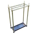 An Edwardian brass and cast iron stickstand, the tubular rails enclosing six divisioned