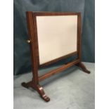 A rectangular nineteenth century mahogany dressing table mirror supported on ribbed pillars with