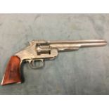 A Smith & Wesson non-firing replica .45 western pistol, with wood handle, nickel body and barrel,