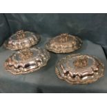 A set of four ninteenth century hallmarked silver tureens & covers with foliate scrolled berry