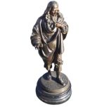 A nineteenth century bronzed figure of an eighteenth century style gentleman, the cloaked figure