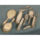 A married twelve-piece silver ladies dressing table set with mirrors, brushes, nail buffer,