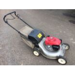 A Honda petrol engine garden mower, with easy start, complete with grassbox.