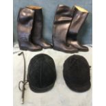 Two pairs of Aigle rubber riding boots - size 8 & 4; a riding crop; and two jockey skull caps. (7)